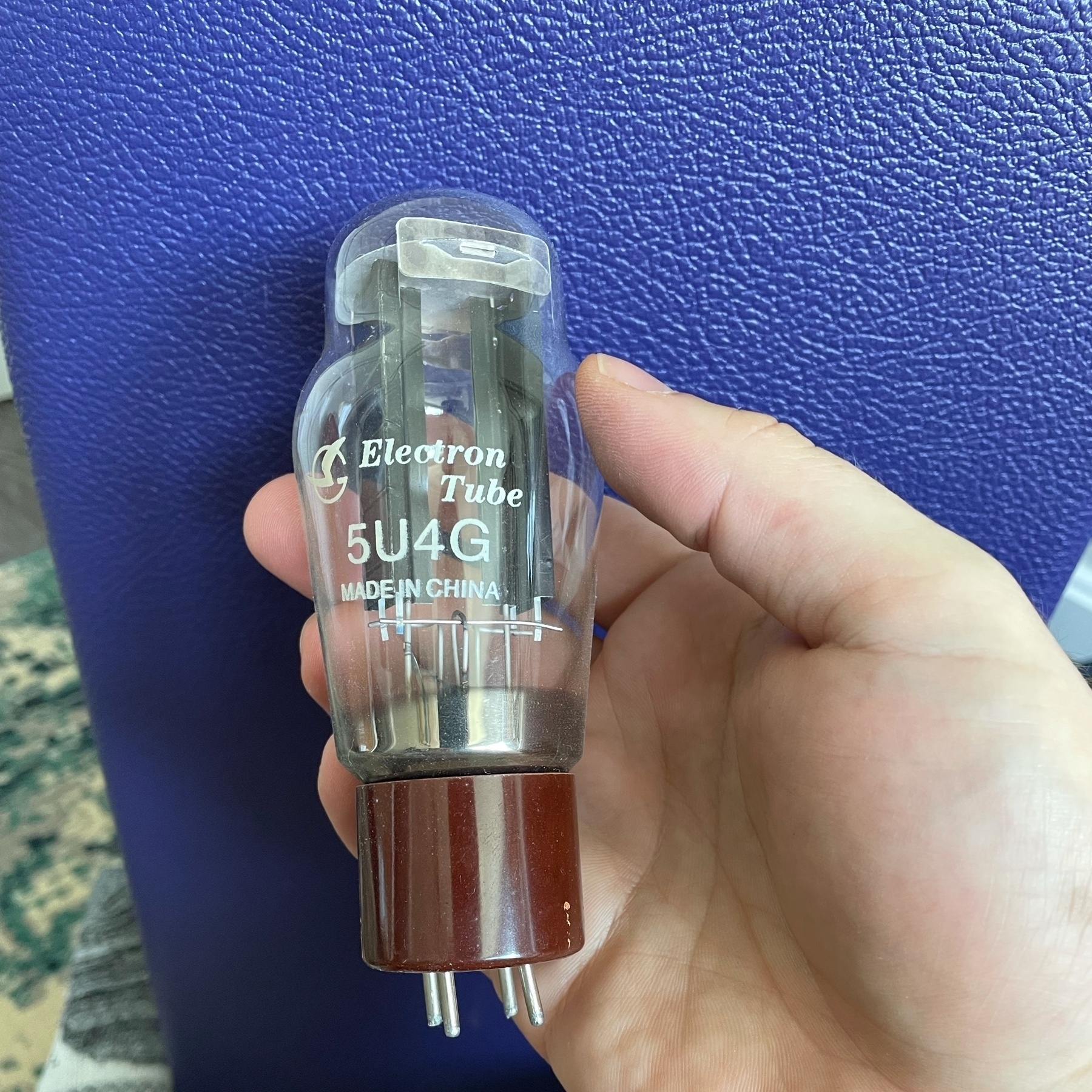 5U4G rectifier tube in front of purple tolex.
