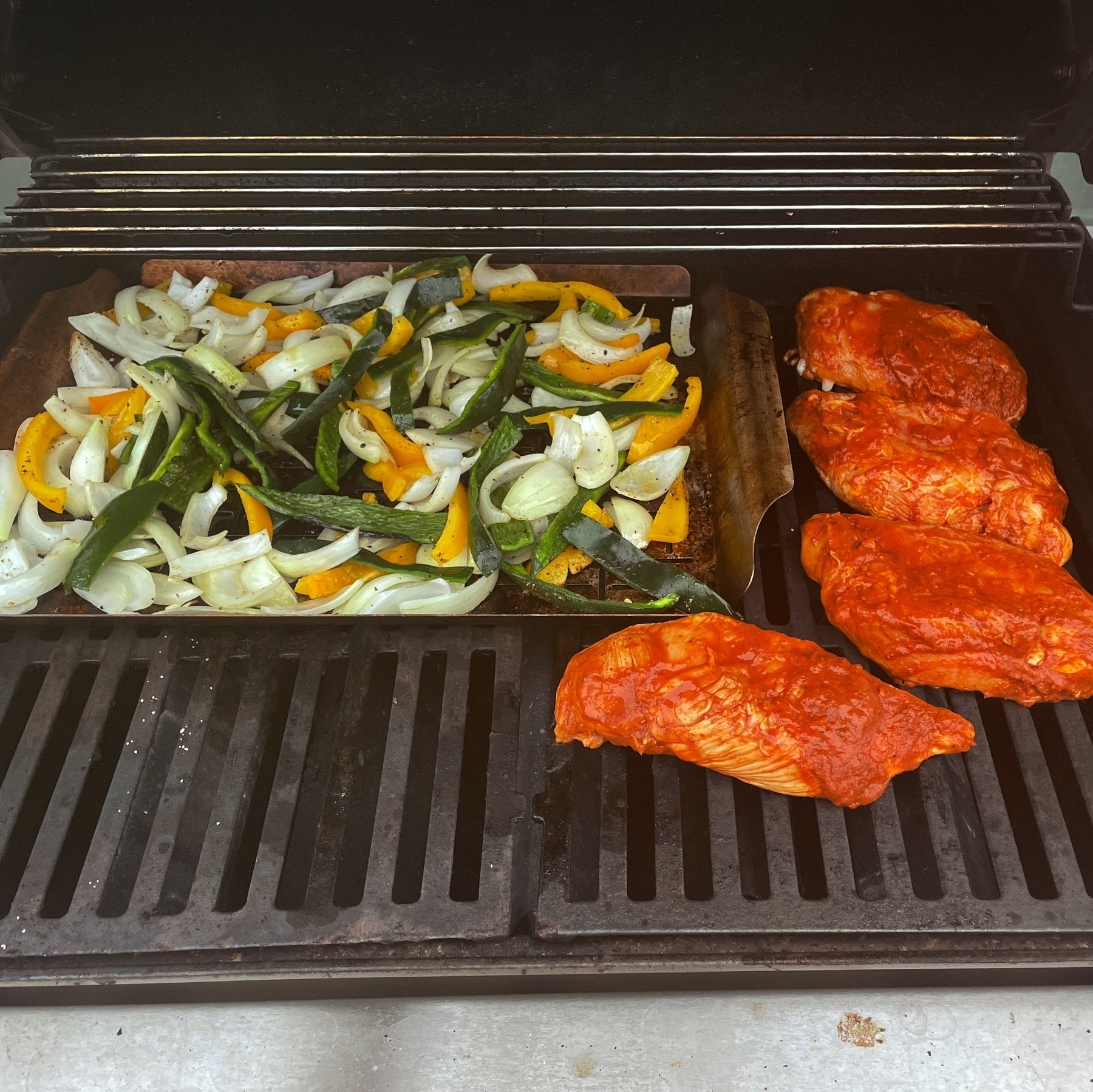 Chicken and veggies on the grill.