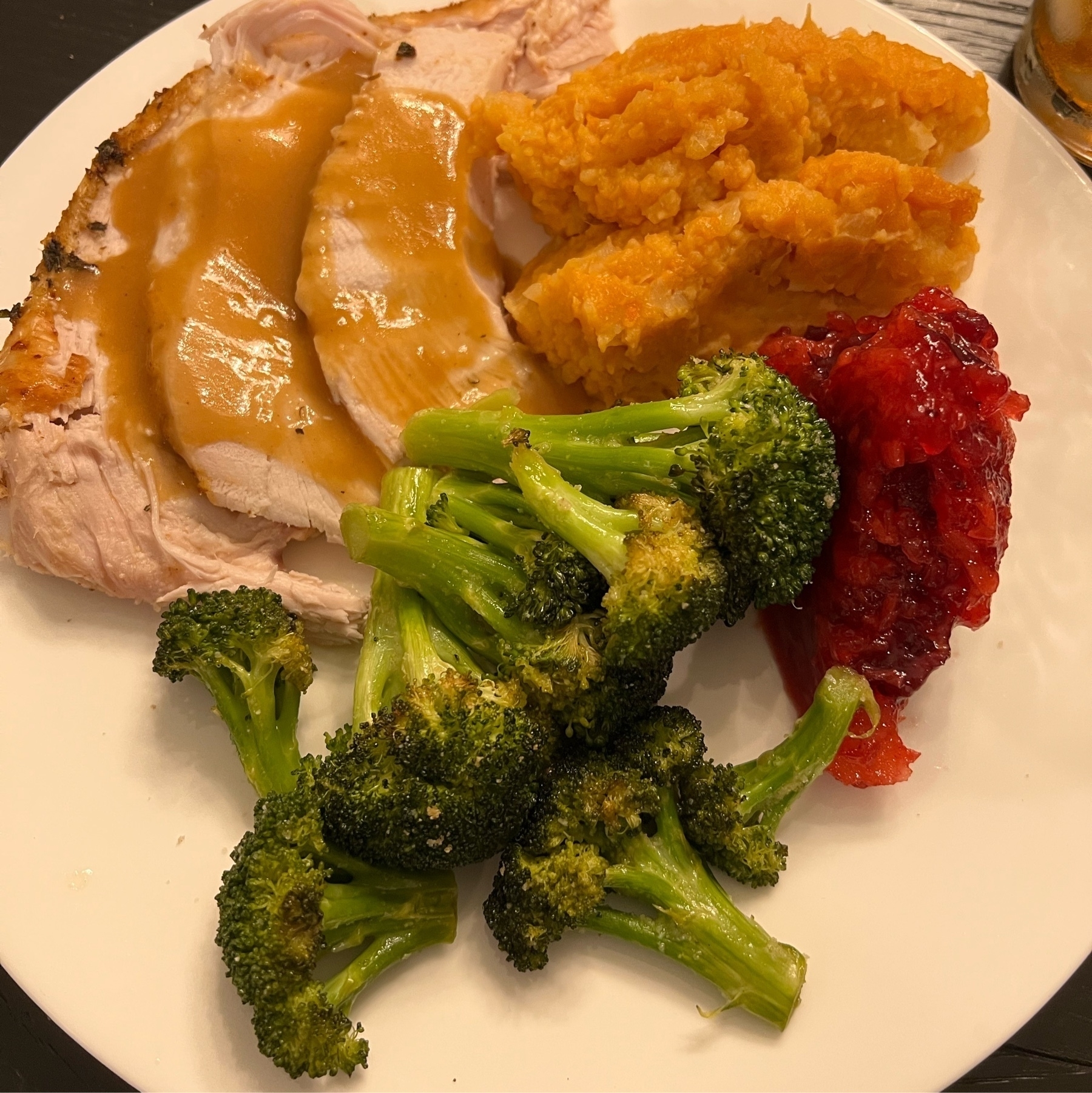 Turkey and gravy, sweet potato, cranberry, and broccoli.