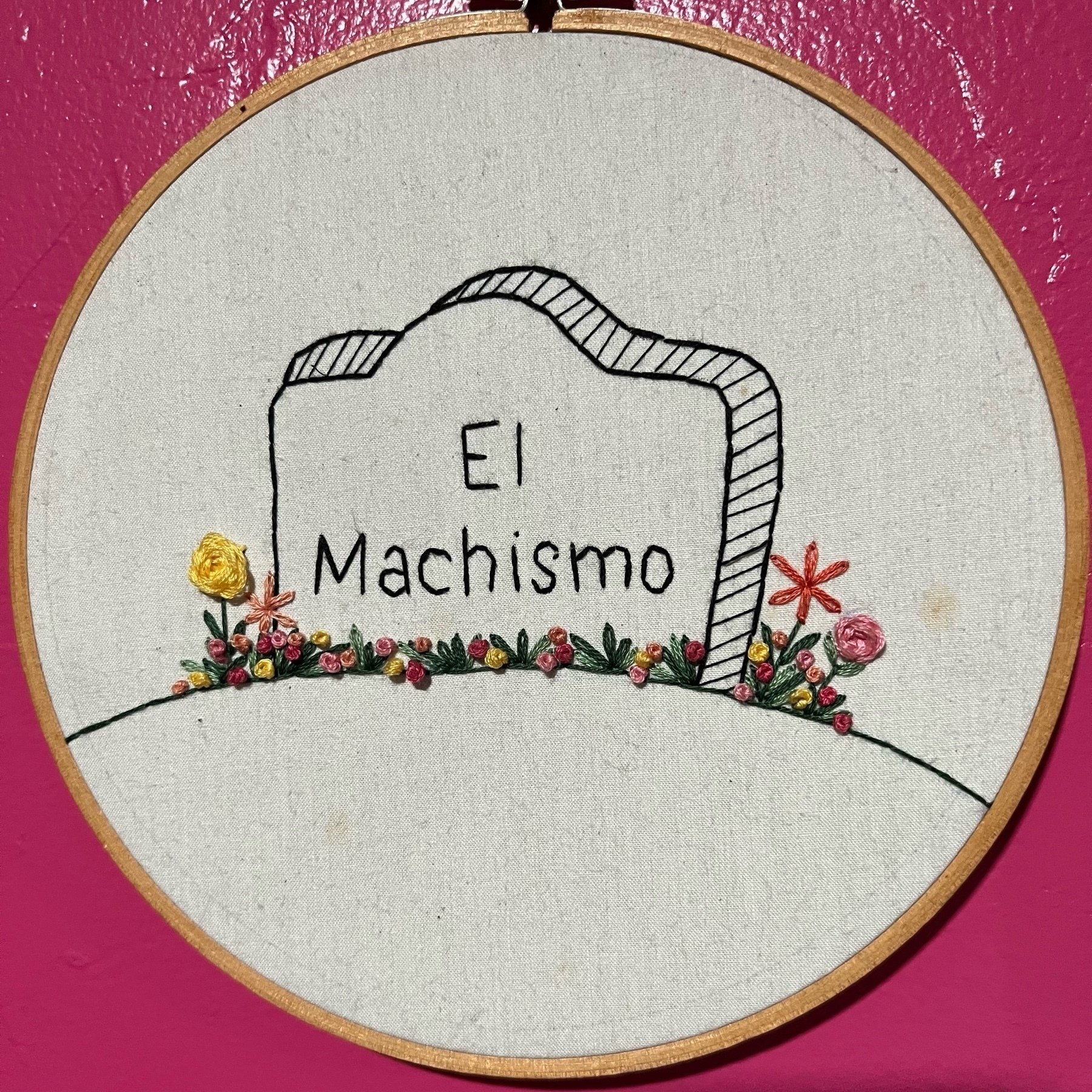 Machismo stitched onto a gravestone.
